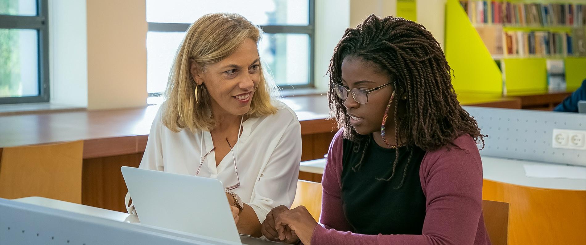 woman smiling at another woman