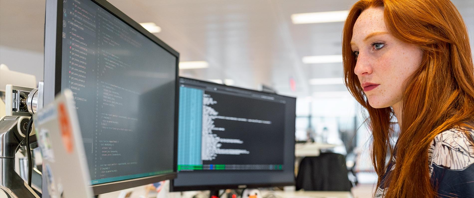 woman looking at a monitor