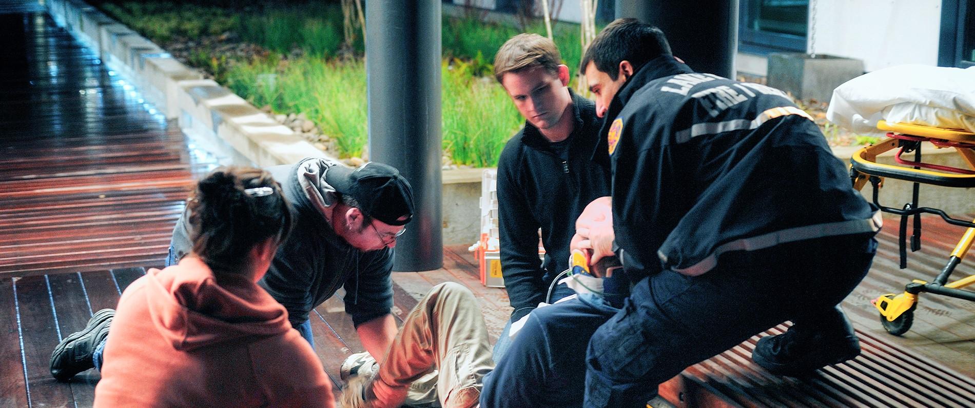 EMT students practicing treatment techniques
