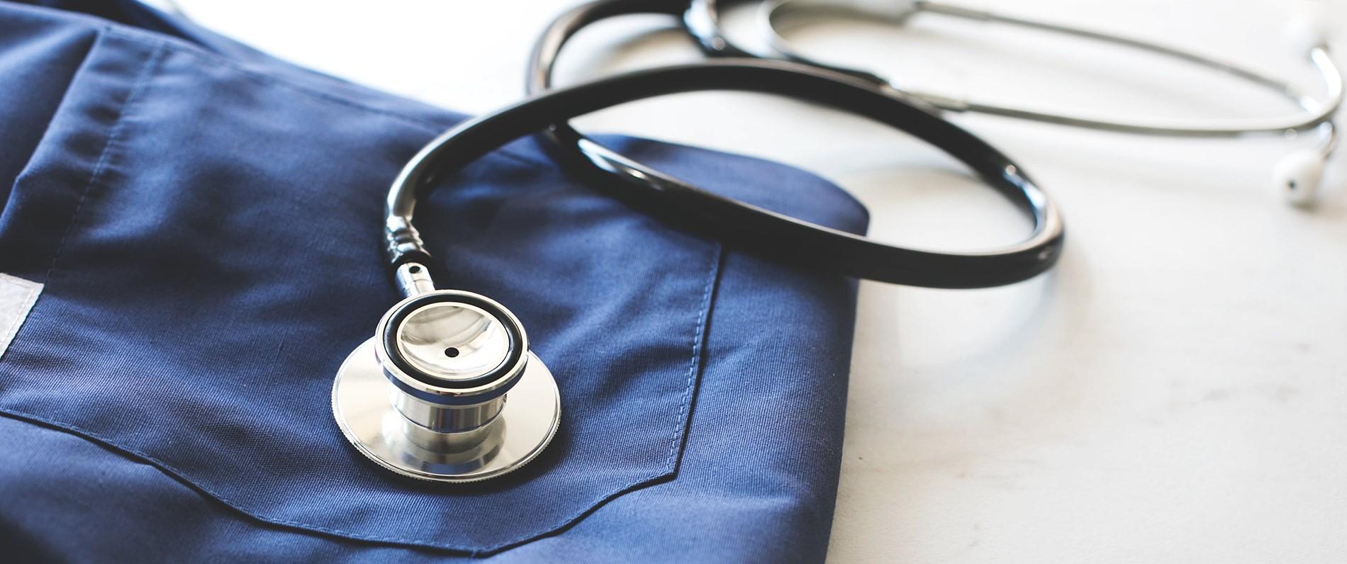 certified nursing assistant scrubs and stethoscope