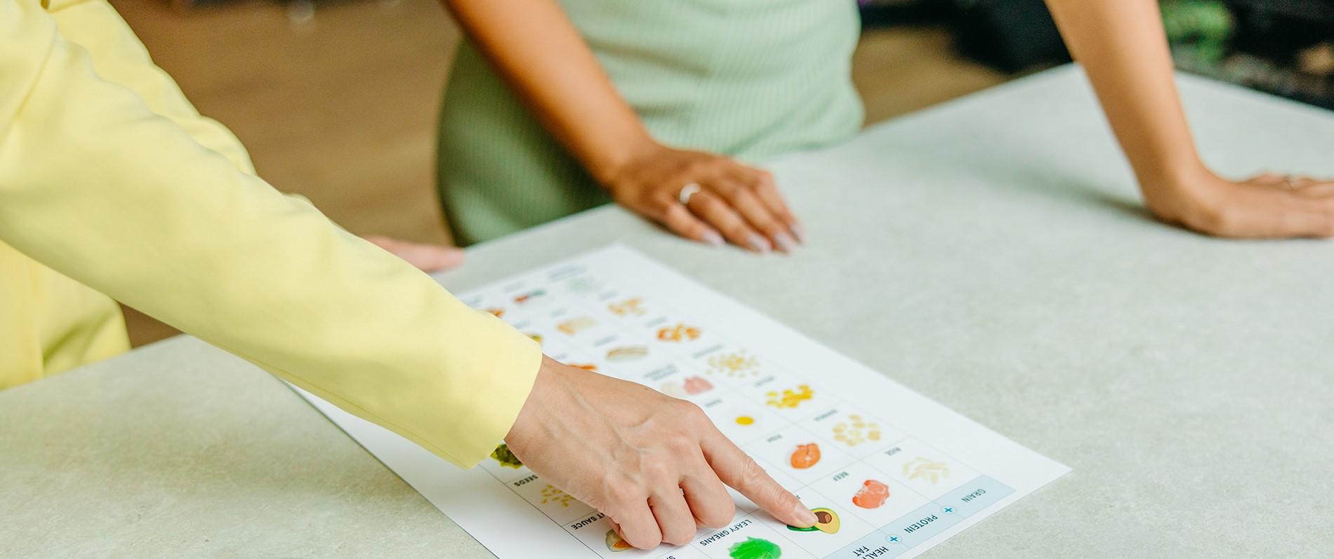 a nutritionist trains a nutrition program student