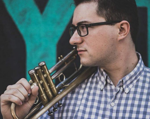 Kelly Kelso Holding trumpet