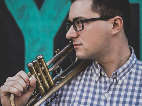 Kelly Kelso Holding trumpet