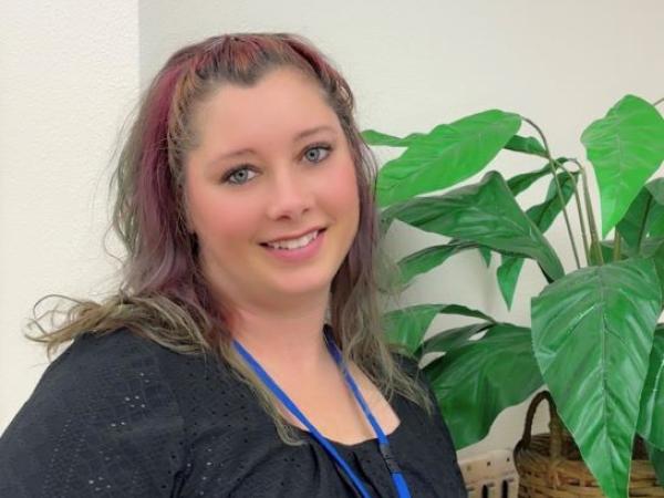 Mayme Stearns, a Career Pathway Coach with kind eyes and tattoos 