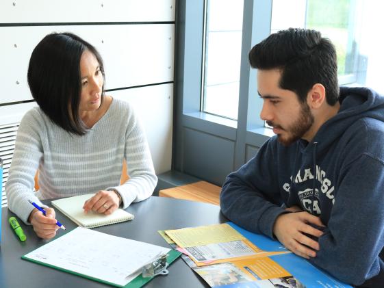Advisor talking to student