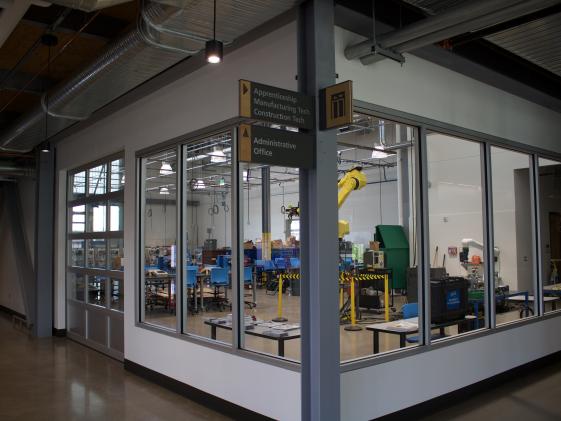 ITEC building interior showing info signs and CNC workspace