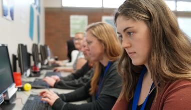 Oregon students taking tests for their online college class