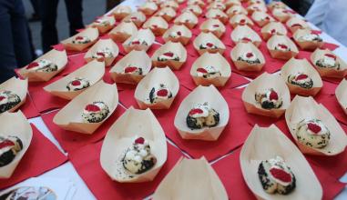 Small bites of Japanese milk bread sweet rolls with raspberry and marscapone in bamboo boats