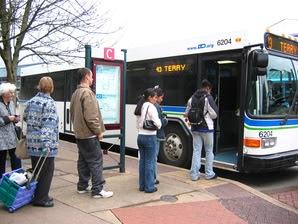 bus riders waiting to board bus