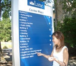 a tudent looking at directions to ESL Program on campus