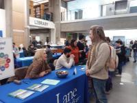 students looking at resources at resource fair