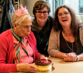 SAI volunteers and client celebrating birthday