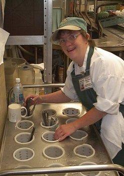 Student Worker sorting silverware at LCC's Food Services Dept.