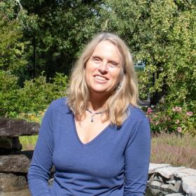College Achievement Coach Rebecca Vincent, a friendly woman in a blue sweater