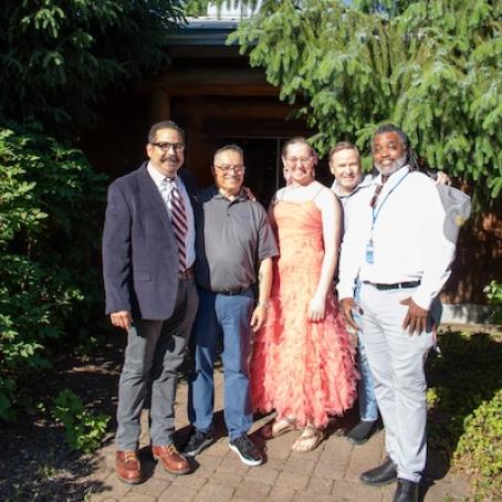 a group of smiling people at MEChA's Celebramos ceremony, including Dr. Pierre Morton, VP of Cultures and Belonging