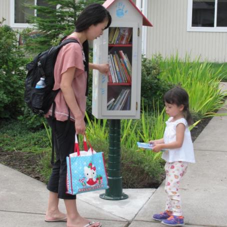 mother and daughter look for book