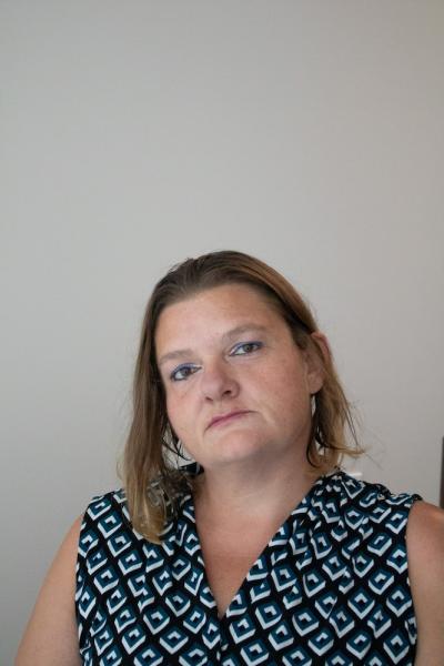 a woman in her 40s with a short bob and stylish eyeliner