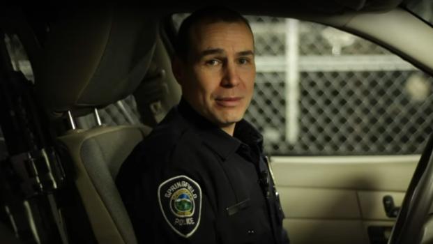 a Springfield police officer sitting in a police car